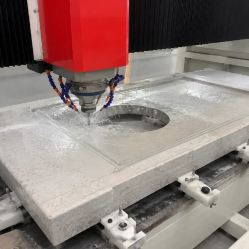 The stone CNC machining center is processing the countertop.